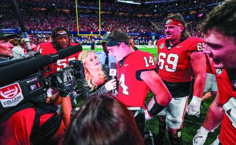 Georgia quarterback Gunner Stockton talks with ESPN reporter Holly Rowe following the Bulldogs’ 22-19 win over Texas in the 2024 SEC Championship game at Mercedes-Benz Stadium in Atlanta. COURTESY OF UGA ATHLETICS