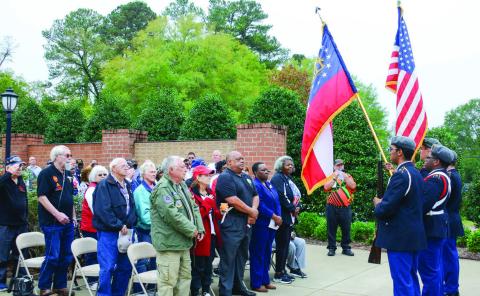 Members of the Putnam County Junior Reserve Officers Training Corps presented the nation’s colors Monday morning for Veterans Day at Putnam County Veterans Wall of Honor Park in downtown Eatonton. IAN TOCHER/Staff