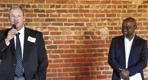 Putnam County Manager Paul Van Haute addresses the crowd at Barrel 118 while Habitat for Humanity of Putnam Executive Director Murali Thiramul looks on during the announcement of Carter Crossing, expected to begin construction next spring. IAN TOCHER/Staff