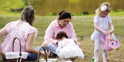 Pretty in pink. One of the Uncle Remus Golf Course ponds provided a perfect Easter backdrop for a family gathering during Saturday’s inaugural Leadership Putnam Easter Egg Hunt. IAN TOCHER/Staff