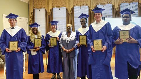 L-R: Eatonton Youth Leadership graduates John Van de Planque, Baylen Yarbrough, Colby Cash, Eatonton Councilwoman Janie Reid, Seth Harris Jr., Jake Rich, and Jay Terrell. EMME CLAUSE/Staff