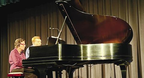 Festival Hall unveiled its new Steinway piano during a Piano and Art Celebration July 19. CONTRIBUTED