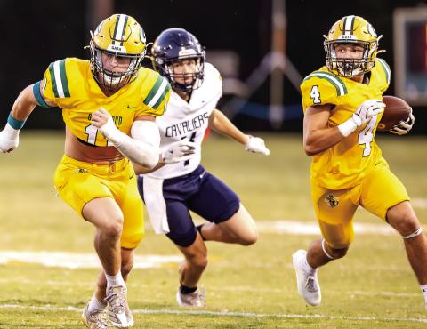 Gatewood senior linebacker Mason Sinclair (left) helps clear a path for junior running back Landon Moreno on one of many carries he had, including two touchdown runs in a 13-10 win Friday night in Eatonton. CONTRIBUTED