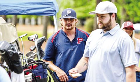 Putnam County assistant football coach Simon Petit helps participants before the start of last year’s tournament. CHARLES JORDAN/Staff