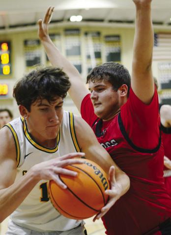 Coach Don Keiser said he likes the physical rebounding presence of Jake Rich (left) beneath the basket for the Gators. IAN TOCHER/Staff