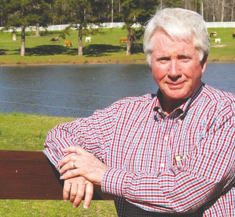 Tex McIver smiles when prompted, even though his eyes are still teary from a 2017 interview with The Eatonton Messenger, as he leans against the fence on his Pea Ridge Road ranch in Putnam County. McIver’s attorneys plan to seek bond after his conviction was overturned last week. LYNN HOBBS/File Photo