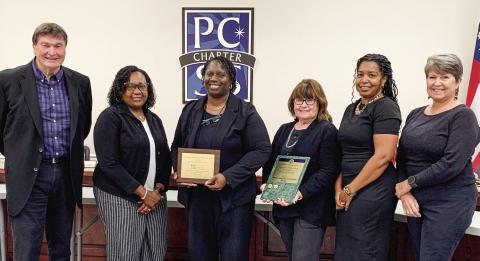 The finance department of the Putnam County Charter School System were awarded by the Association of School Business Officials International and Government Finance Officers Association. BAILEY McCULLY/Staff