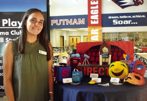Musical Theater student Joelle Lukens shows off the hand-made projects created in the different Fine Art programs.