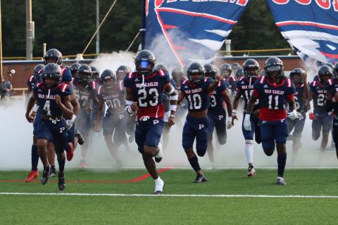 DJ Bland (4), Jalon Kilgore (23) and Tyson Waller (11) lead the War Eagles onto the field. ARELLA CASH/Staff