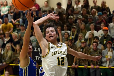 Gatewood freshman Matt Allen (12) swats away a Brentwood guard's layup last Friday.