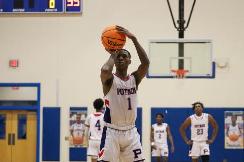 Putnam County senior Eren Banks (1) lines up a free throw shot in a win over Butler last week in the Region 4-AA semifinals. LANCE MCCURLEY/Staff