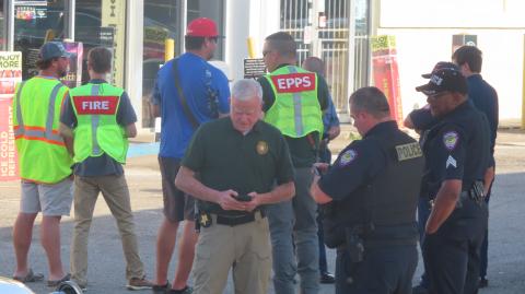 Eatonton police officers, fire department personnel and Putnam County Sheriff's deputies at the Shell Food Mart on Sumter Street where a shooting happened Sunday. (Contributed photo)