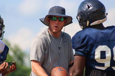 Joel Harvin coaches up a player during spring camp last May. LANCE McCURLEY/Staff