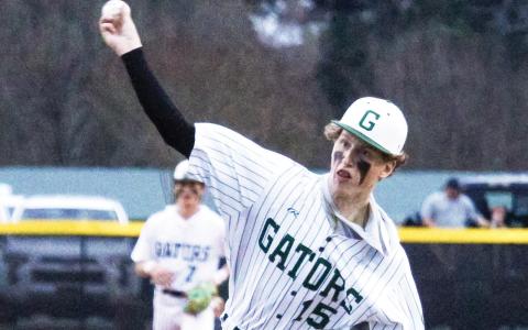 Gatewood senior Lawson Wooten (15) brings the heat last Tuesday in the Gators’ season opener at home against the Westfield Hornets. TREY NORRIS/Staff