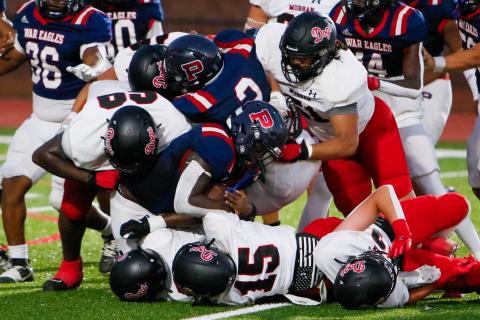 Putnam County running back Rashod Daniel (3) is brought down by a group of Morgan County defenders in a game earlier this season. (LANCE MCCURLEY/Staff)