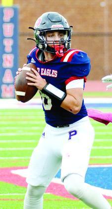 Putnam County quarterback Branan Griffin (8) drops back to pass in a loss to Social Circle. IAN TOCHER/Staff
