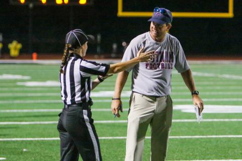 Putnam County head coach Joel Harvin (right) talks to a referee about a call in a game against Greene County earlier this season. FILE PHOTO