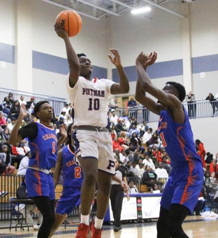 Junior Tamaud Woodson (10) was the top scorer for the War Eagles in a big 90-62 win over Central to open state playoffs last Wednesday at home in Putnam County. TREY NORRIS/Staff