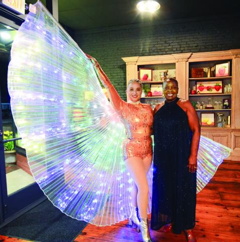  Eatonton City Councilmember Janie Reid (right) took a moment near the entrance to Barrel 118 to pose with a Canopy Studio dancer from Athens. IAN TOCHER/Staff