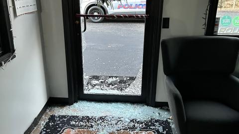 Shards of glass are scattered and piled around the back door of the Grease Monkey after burglars broke their way inside early Wednesday morning. CONTRIBUTED/EPD 