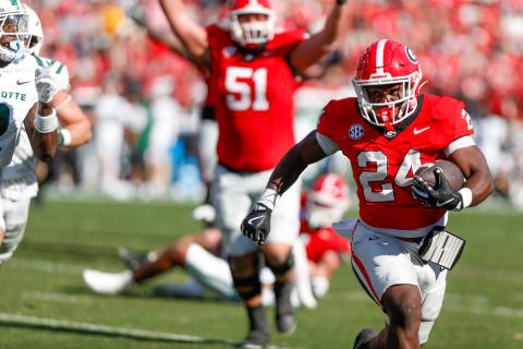 Freshman running back Bo Walker (24), playing his first meaningful minutes for Georgia, made the time count with three touchdowns in a 35-3 rout of Charlotte. LANCE McCURLEY/Staff