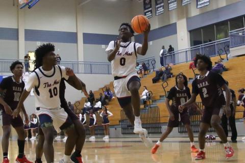 Putnam County senior Tamaud Woodson goes up for a layup in a win over Southwest Atlanta Christian on Jan. 13. TREY NORRIS/Staff