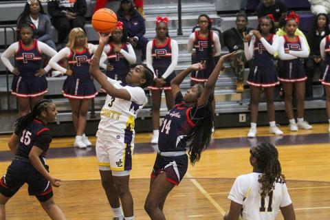 Jones County's Aubrey Norris (3) goes up for a layup as Putnam County's  Jaikarccie Smith (14) tries to block the shot. BRAD HARRISON/Staff
