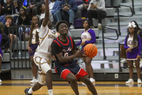 Putnam County senior Tamaud Woodson (0) attempts to go up for a layup against a Jones County defender inside the paint in a loss to the Greyhounds on Jan. 3. BRAD HARRISON/Staff