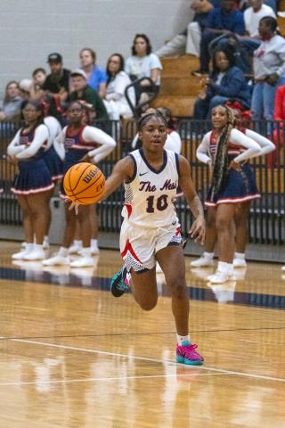 Putnam County guard brings the ball up the floor in a region tournament semifinal game against Jasper County on Feb. 18. SKYLA MORRIS/Staff
