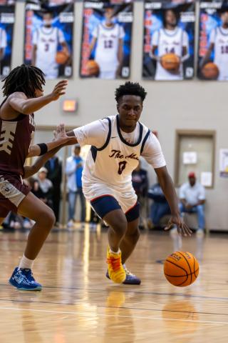 Putnam County senior Tamaud Woodson drives the floor in transition past a defender during a game against Southwest Atlanta Christian in the semifinal round of the Region 2-2A tournament on Feb. 19. SKYLA MORRIS/Staff