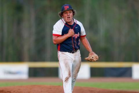Putnam County senior Jackson Dodd pumps himself up on the mound after a big strikeout, helping the War Eagles maintain momentum game one against the Hurricanes. LANCE MCCURLEY/Staff