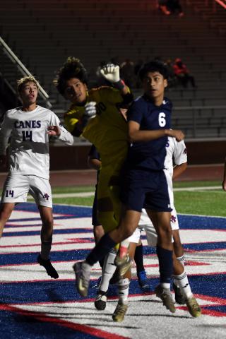 Putnam County goaltender Jared Mejia (in yellow) has developed into a solid performer this season as the War Eagles’ backstop. IAN TOCHER/Staff