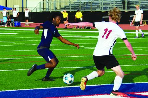 Putnam County senior R.J. Hines (left) scored the War Eagles' lone goal in a 1-0 victory over Dade County on April 22. IAN TOCHER/Staff