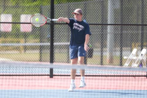 Putnam County’s No. 1 singles player Leland Erickson returns a serve during a volley in Monday’s match against Lamar County. LANCE McCURLEY/Staff
