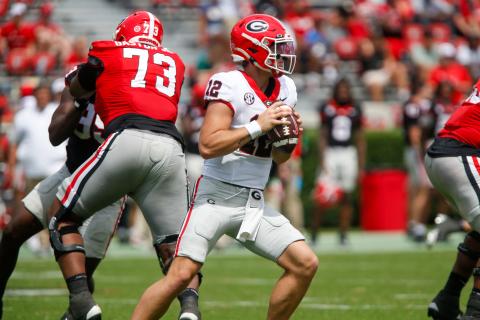 Georgia redshirt freshman quarterback Ryan Puglisi (12) fires a pass downfield during the G-Day scrimmage. LANCE McCURLEY/Staff