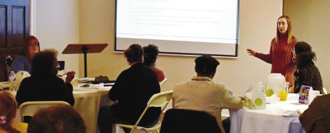 Eatonton-Putnam Chamber of Commerce President Maggie Milner (standing) was the anchor speaker for the Business Education Expo recently presented by Eatonton Main Street. LENA HENSLEY/Staff