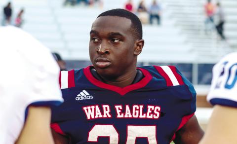 Former Putnam County running back Tamarion Peters represents the War Eagles as a team captain last season before the start of their home matchup against Oconee County, LANCE McCURLEY/Staff