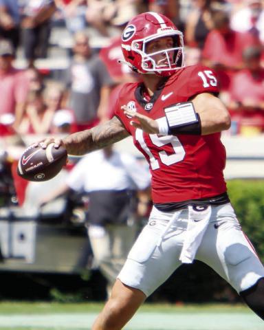 Georgia quarterback Carson Beck tied a program record by tossing five touchdowns against Tennessee Tech. (LANCE MCCURLEY/Staff)