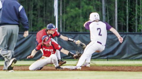 Putnam County shortstop Gates Lanzarone (11) applies the tag to a Jasper County baserunner, who was initially ruled out, while colliding with teammate and second baseman Trace Watkins. The call was then overturned, leading to the runner scoring to secure the Hurricanes the win during the next at-bat. LANCE McCURLEY/Staff