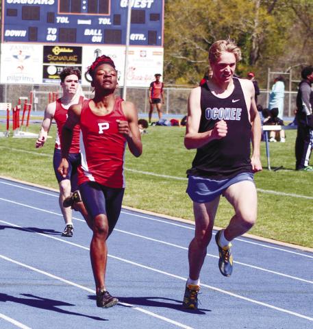 Brandon Brown chases down a runner from Oconee County. ARELLA CASH/Staff