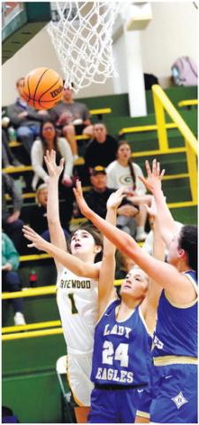 Eighth-grader Lauren Paxson (1) shoots a layup over two Brentwood defenders. DR. BOB BETZEL/Contributed