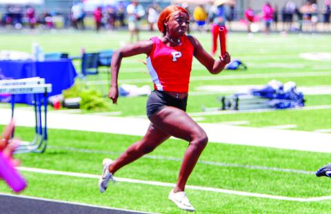 Putnam County’s Baylen Yarbrough runs a leg of the 4x200-meter relay race. LANCE McCURLEY/Staff