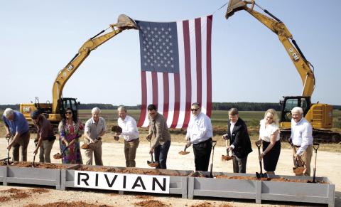 Rivian founder and CEO RJ Scaringe (third form left), with Georgia Gov. Brian Kemp to the right, break ground on the Stanton Springs project site in Social Circle, alongside several other state and local representatives. SKYLA MORRIS/Staff