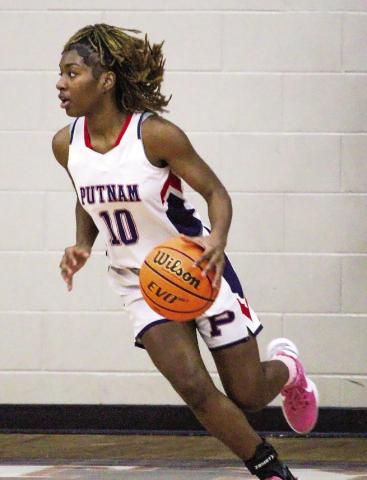 Freshman Journey Waller (10) brings the ball up the court in transition at home against Butler last Tuesday. TREY NORRIS/Staff