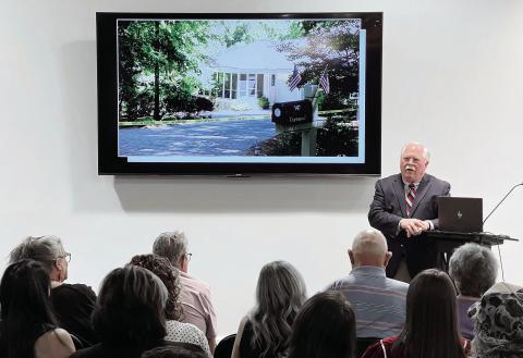 With a photo of the Dermonds’ Great Waters home on the TV mounted behind him, Putnam County Sheriff Howard Sills presents the evidence gathered so far in what he admits is the “toughest case” of his career so far. IAN TOCHER/Staff