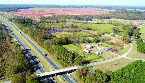 Rural landowners continue to work to preserve the agricultural lifestyle in the area of the new Rivian EV manufacturing plant along I-20 on the Morgan-Walton county line. The dirt in the background stands in contrast to farms located in the area. MARK ENGEL/Staff