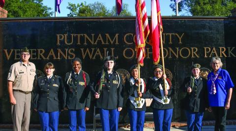 Putnam County High School’s MSgt. Michael Taylor (left) led several Junior Reserve Officers’ Training Corps (JROTC) members who served as the color guard last Thursday for the 9/11 remembrance ceremony at the Putnam County Veterans Wall of Honor Park in Eatonton. IAN TOCHER/Staff