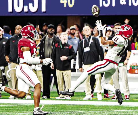 Georgia wide receiver Arian Smith (11) got into the action during the SEC Championship game against Alabama on a 51-yard reception. CHARLES JORDAN/Staff