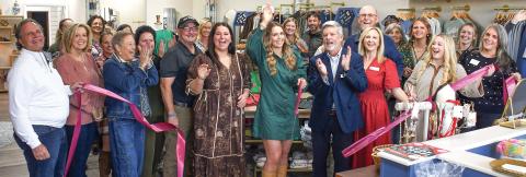 Sisters Megan and Mallory Fitzgerald (l-r, center) celebrate with friends and family at the official ribbon cutting Nov. 14, for their new Three Rays Boutique &amp; Head Spa at 646 Old Phoenix Rd., Eatonton. IAN TOCHER/Staff