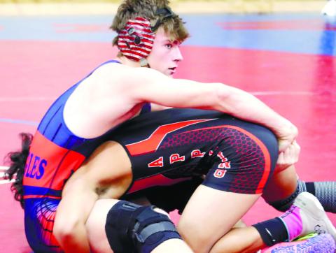 Mark Winslette attempts to pin an opponent during a match last season. ARELLA CASH/File photo